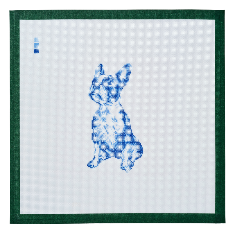 A needlepoint canvas printed with a Boston terrier in blue toile on white mesh.