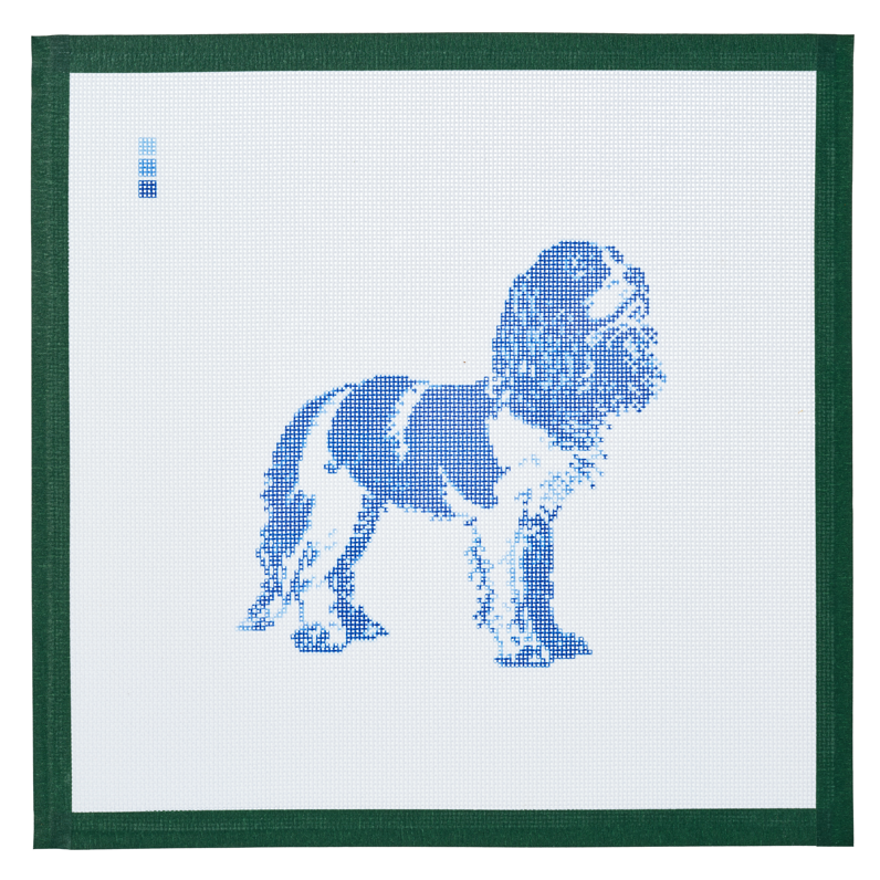 A needlepoint canvas printed with a King Charles cavalier in blue toile on white mesh.