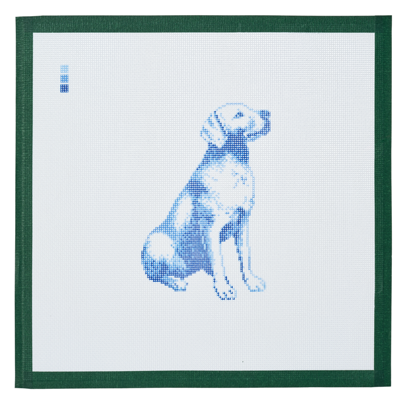 A needlepoint canvas printed with a labrador retriever in blue toile on white mesh.