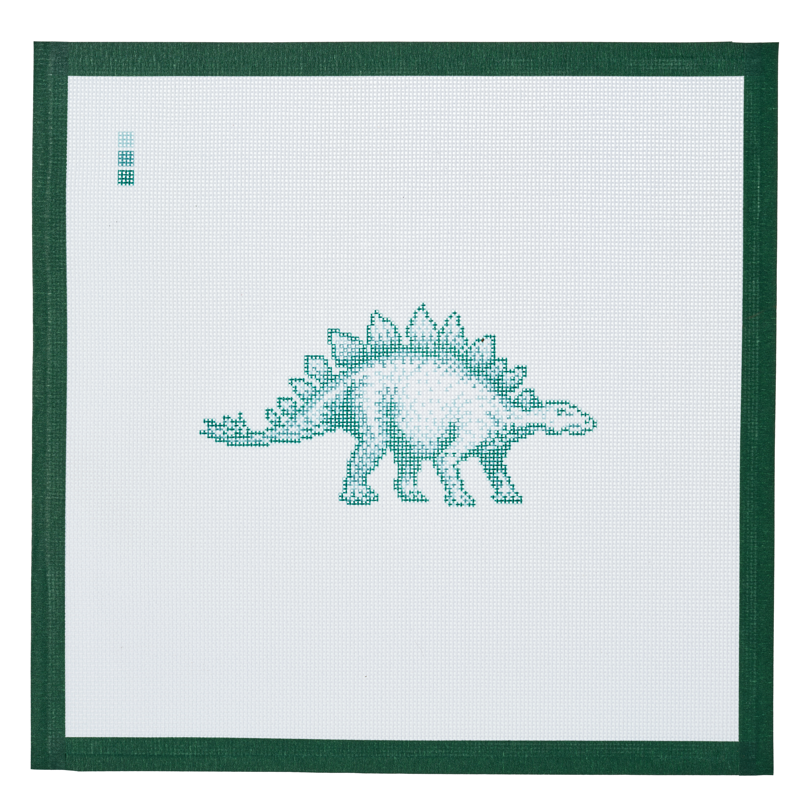 A needlepoint canvas printed with a stegosaurus, on white mesh with a dark green taped edge.