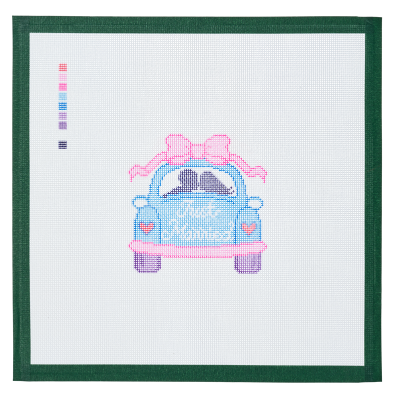 A needlepoint canvas printed with a blue wedding getaway car trimmed with a pink bow.