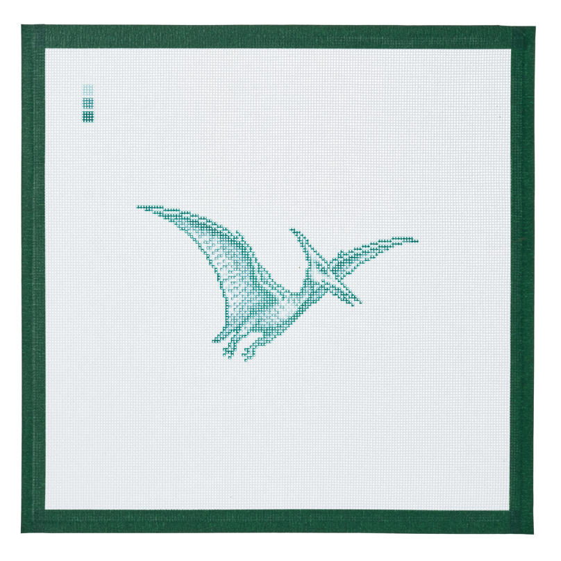 A needlepoint canvas printed with a pterodactyl in flight, on white mesh with a dark green taped edge.