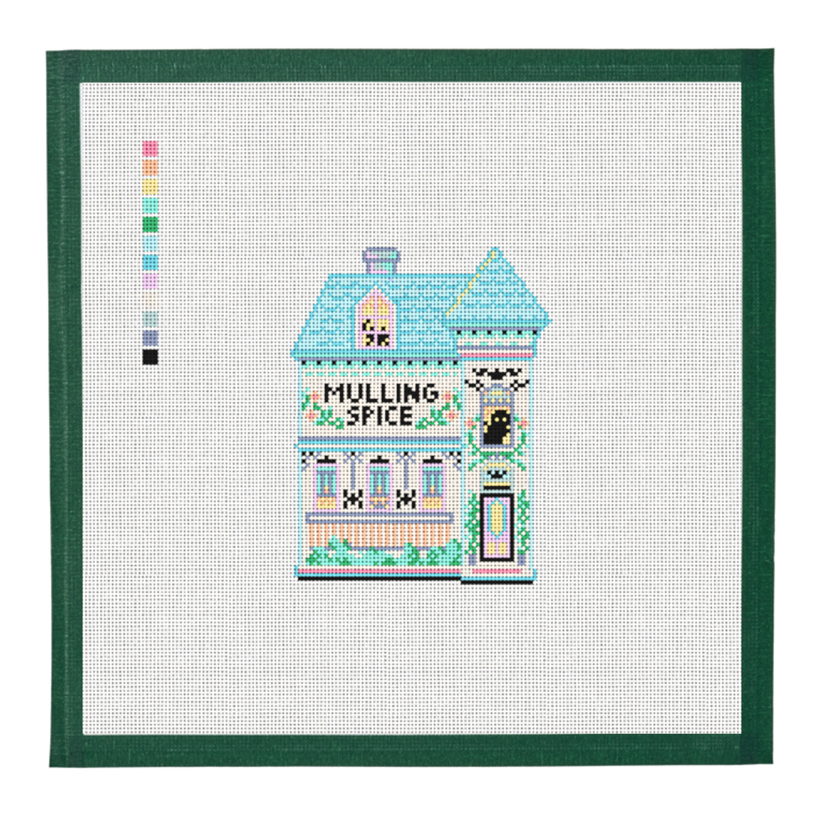 A needlepoint canvas of the Mulling Spice house from the Halloween Spice Village, on white mesh with a green taped edge.