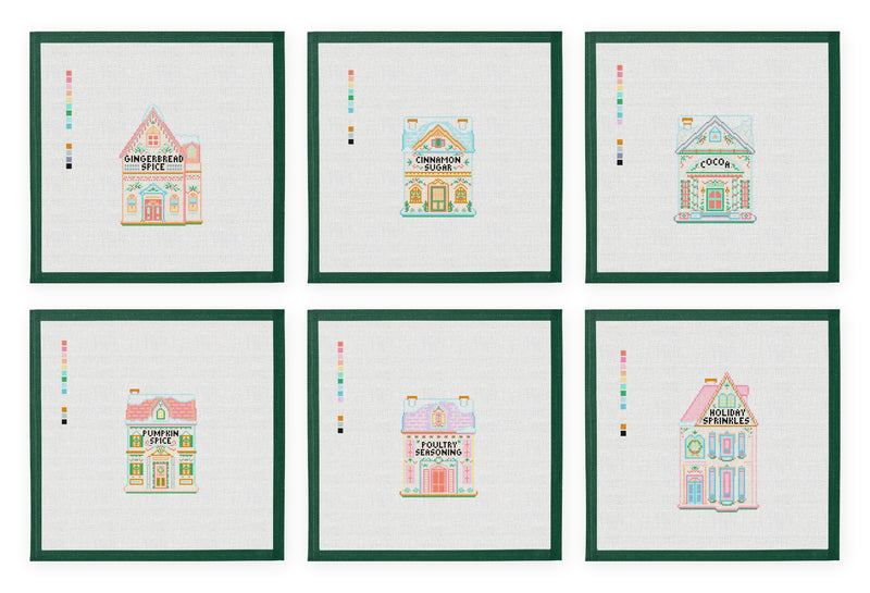 The six Christmas Spice Village needlepoint canvases, each with its green taped margin, arranged in two rows on white.